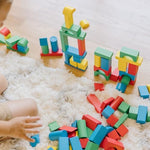 Educational developmental blocks showing various sizes for fine motor skill practice.