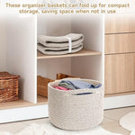 Cute round woven toy storage container filled with nursery items and baby blankets on a changing table