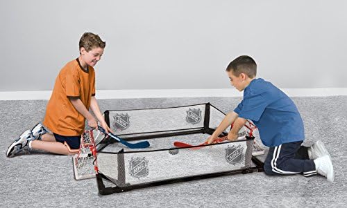 Franklin Sports Kids Knee Hockey Rink Game Set goals with sticks and pucks.
