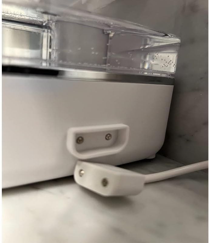 Pralota charging cable connected to a Waterpik ION cordless flosser unit