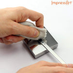 Wiping excess ink from metal stamping project