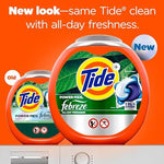 Close up of Tide 4-in-1 laundry detergent pacs showing concentrated blue and green chambers.