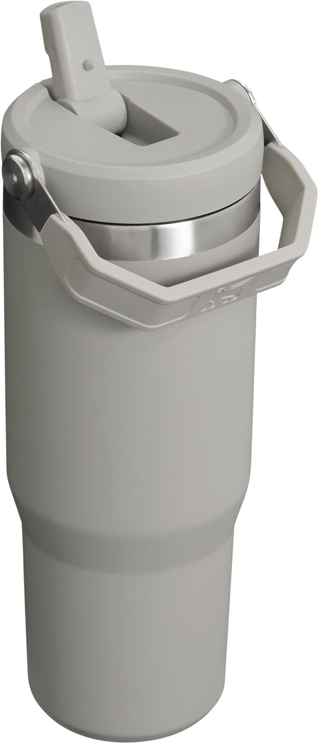 Stanley insulated reusable water bottle showcasing the rotating carrying handle and leak resistant lid