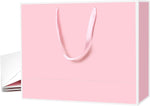 Pack of 6 Xloey luxury paper shopping bags ready for use.