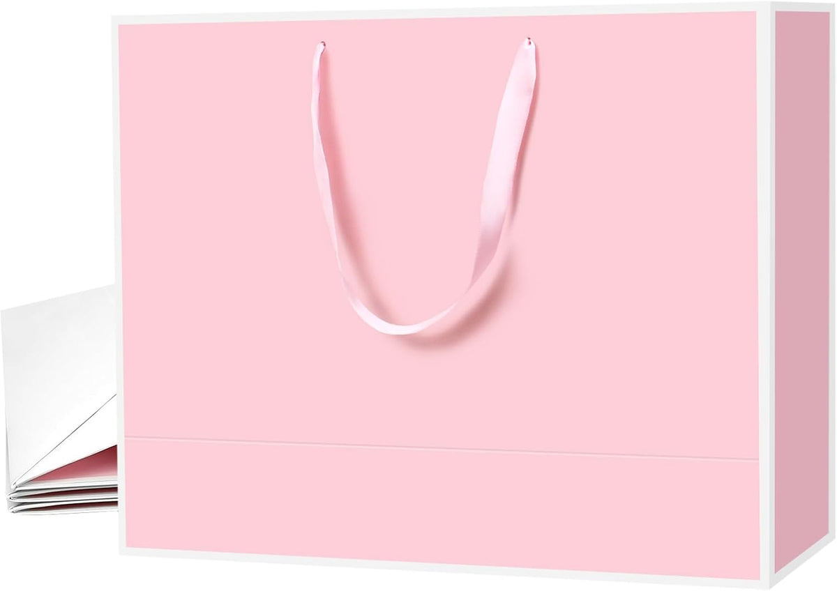 Pack of 6 Xloey luxury paper shopping bags ready for use.