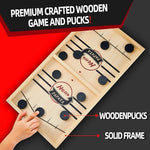 Premium solid wood hockey table game with players launching wooden pucks through the center gate.