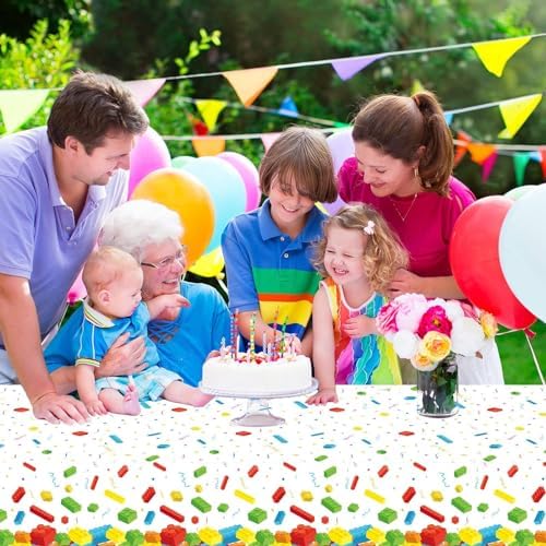 Kids birthday party table setting with Chiazllta building blocks plastic tablecloth and matching supplies