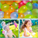 Biodegradable natural latex water balloons in red pink and yellow colors spread on grass