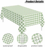 Two pack disposable sage green gingham tablecloths folded