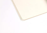 Clairefontaine deep blue notebook showing thread stitched binding