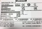 Lenovo professional electronic docking station top view showing matte black finish and compact desktop footprint.