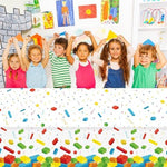 Chiazllta building blocks disposable tablecloth protecting a rectangular birthday cake table from juice spills