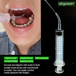 Oral irrigation syringe with 12ml scale for flushing tonsil crypts.