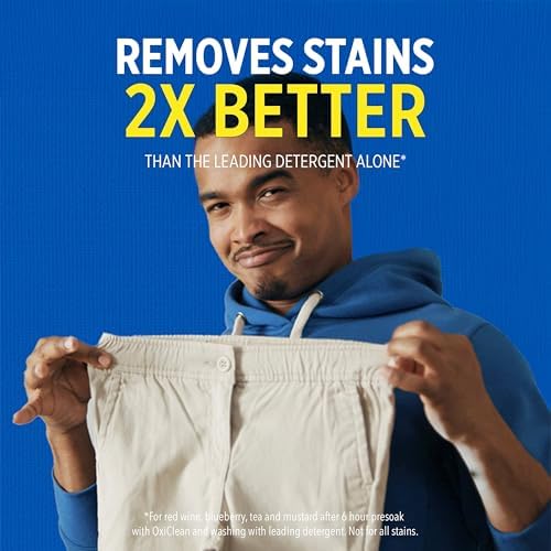 OxiClean powder stain remover being added to a high efficiency washing machine