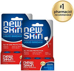New-Skin waterproof liquid bandage brush applicator tool being pulled from the bottle.