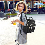 MATEIN small daypack purse displaying the external USB charging port feature