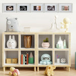 Biubee natural wood ultrasound display frame styled as a tabletop decoration next to soft baby nursery elements.