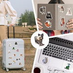 Funny cat meme stickers applied to a laptop