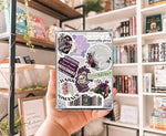 Close up of morally grey aesthetic bookish decor insert inside transparent Kindle case