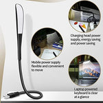 Zonon travel friendly mini desktop lamp folded compactly next to a backpack to demonstrate its lightweight portability.
