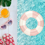 Children using Evechole swim rings in a swimming pool