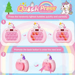 Pink unicorn fast push bubble game toy being held by a child for stress relief