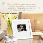 White wooden ultrasound keepsake frame showing the easel backing and triangle wall hanger for versatile nursery display.
