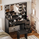 Black vanity desk highlighting the integrated power outlet and USB charging station ports