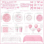 Detailed view of pink bow themed plates and napkins for birthday party