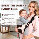Slumberkiddies cow print toddler carrier flat layout highlighting dual adjustment straps