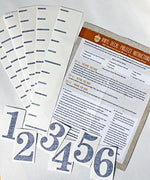 Close up of Little Acorns vinyl numbers for growth chart.