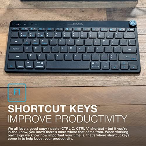 Underside view of the minimalist wireless keyboard showing the battery compartment cover and dedicated storage slot for the USB receiver