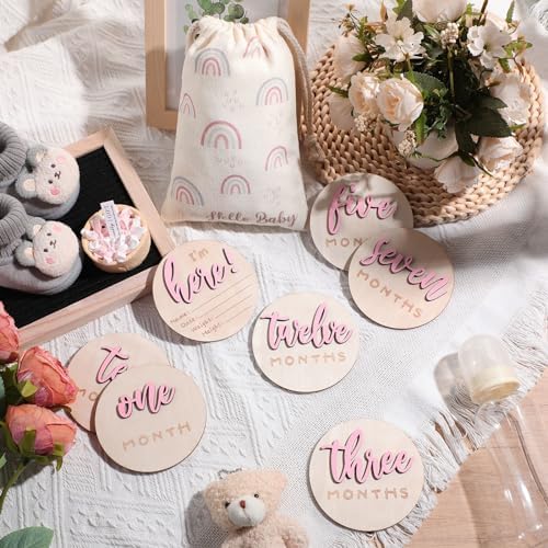 Double sided newborn announcement wooden circles displayed with pink letter detailing