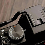 Authentic imported camera handling accessory with soft touch finger button