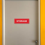 Dark brown storage sign with bold white lettering close up