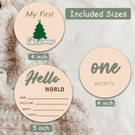 Cephira monthly baby milestone marker discs held near a blanket to demonstrate sizing and safe wood finish
