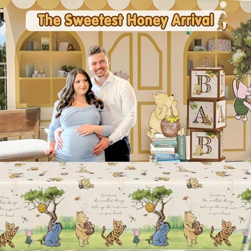 Three count pack of disposable neutral rectangle pooh bear tablecloths laid out flat