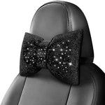Surpassme premium crystal bow car accessories for women installed on a vehicle seat headrest.