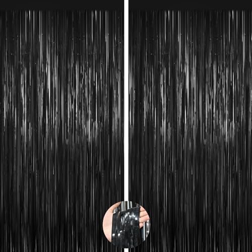 Two pack black metallic fringe curtains installed on a doorway as elegant entrance decorations.