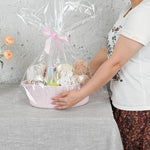 Empty pink gift basket kit by APOMOONS filled with nursery items to demonstrate storage capacity.