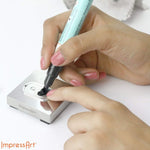 Using enamel marker on stamped metal jewelry