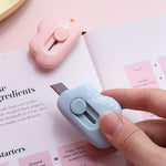 Mini cloud paper cutter highlighting the keychain hole feature