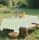 Sage green and white plaid disposable tablecloth on rectangular table