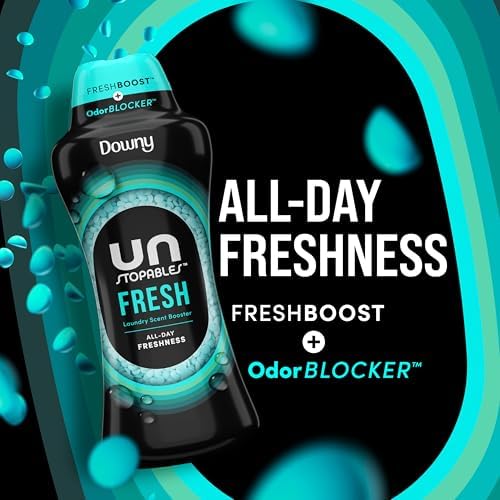Downy Unstopables laundry scent booster beads poured into the cap to show the blue fresh scent pellets.