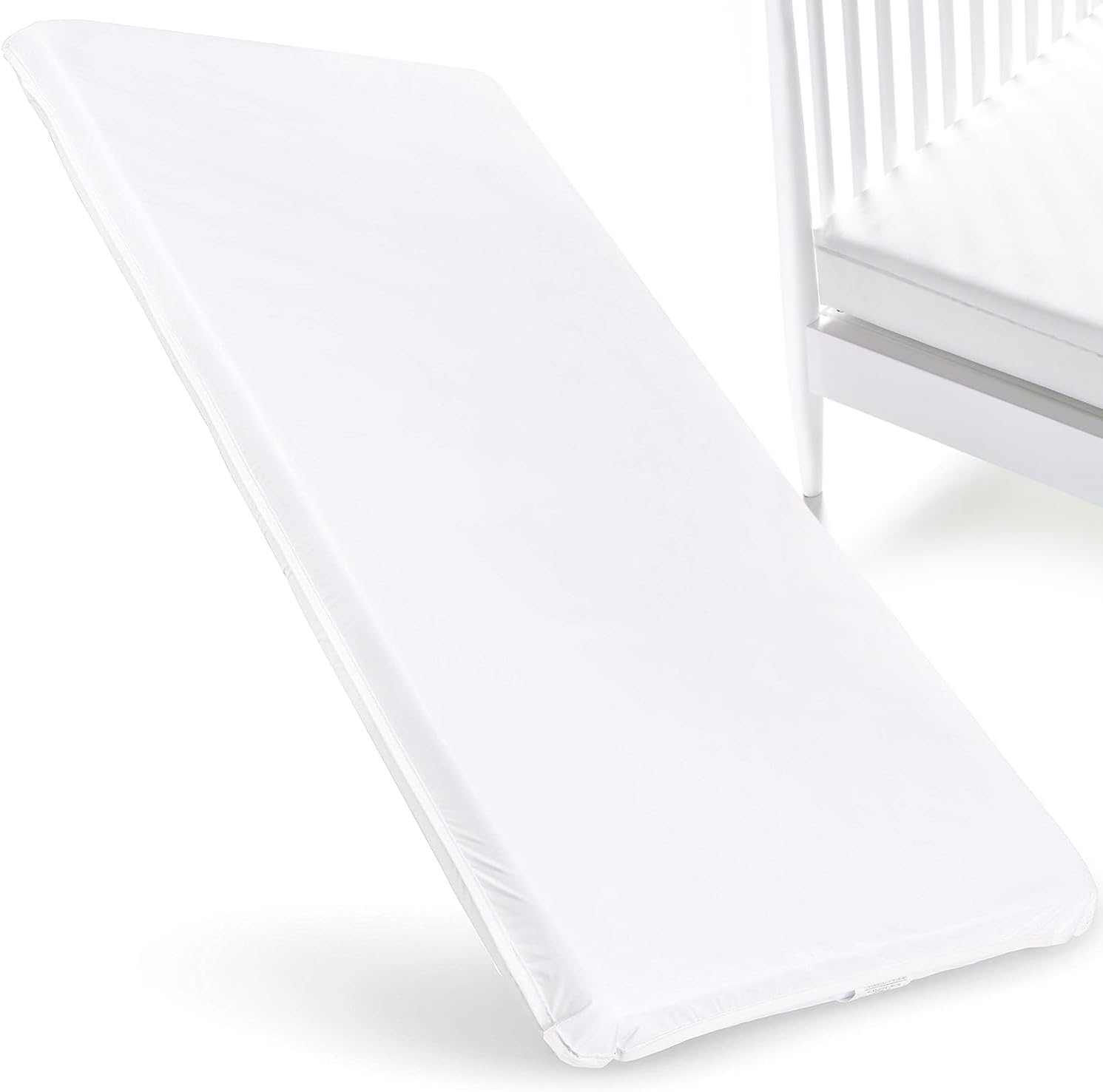 ABaby.com baby cradle mattress front view showing the clean white waterproof vinyl cover.
