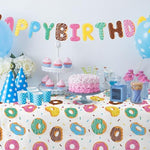 Gatherfun disposable plastic tablecloth protecting a kids party table from spills