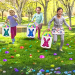 Three pieces of colorful reusable canvas gift bags standing upright filled with treats