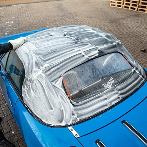 Meguiar's soft top car care solution removing mildew and bird droppings from canvas.