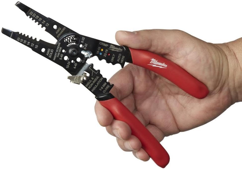 Milwaukee electrical hand tool showing ergonomic red grip handles