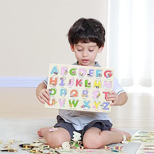 CooVs toddler educational peg puzzle set showing a child lifting the wooden letter A piece.